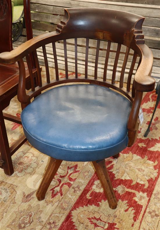 A late Victorian mahogany revolving desk chair